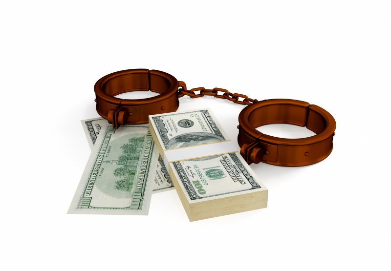 12217866 - shackles and dollar pack. 3d rendered. isolated on white background.